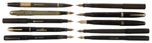 A large collection of fountain pens and spare/incomplete pen parts from the early 20th c