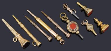 A small collection of 19th c gold clad and yellow metal watch keys and propelling pencils
