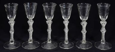 A set of six Georgian style double knopped air twist stem cordial glasses