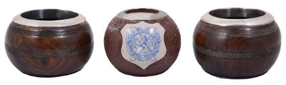 Pair of silver mounted turned lignum vitate match strikers; one other