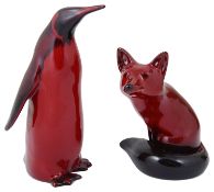 A Royal Doulton flambé penguin and fox