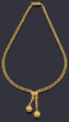 An attractive Etruscan style yellow metal orb tassel necklace, matching the previous lot