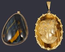 A contemporary diamond set cameo relief pendant