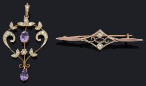 An Edwardian Art Nouveau amethyst and seed pearl drop pendant