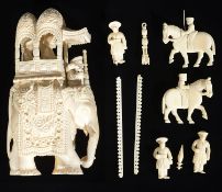 A late 19th c Indian ivory carving of an elephant with howdah and attendants