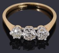 A three stone diamond set ring