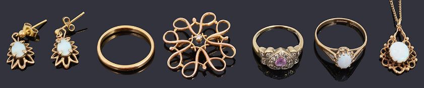 A small collection of gold jewellery including a diamond and gem set heart ring