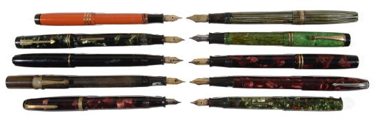 A large collection of early to mid 20th c mottled and plain fountain pens and propelling pencils