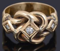 A diamond set love knot design gold ring