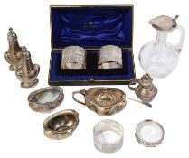 A mixed lot of silver to include an Edwardian Art Nouveau five piece cruet set and napkin rings
