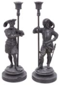A pair of late 19th century patinated spelter figural candlesticks
