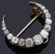 A late Victorian diamond set crescent brooch