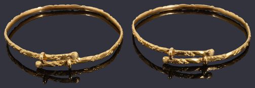 A pair of high carat Chinese tension set bangles