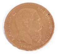 A gold Leopold II 20 Franc coin dated 1875