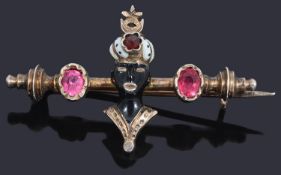 An unusual Continental silver gilt enamel blackamoor pin brooch