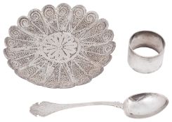 An Islamic white metal filigree dish, possibly Sudanese and other silver items