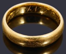 A 22ct gold court shaped wedding ring