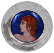 An Arts & Crafts enamel on copper portrait roundel in a circular silver frame