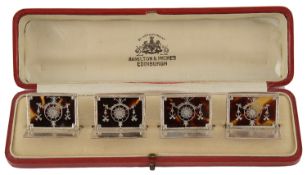 A set of four George V silver and tortoiseshell menu card holders