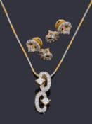 A delicate Indian high carat gold cubic zirconia pendant and matching earrings