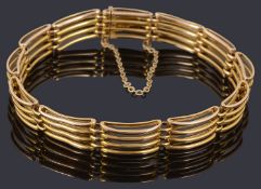 A gold four row gate link bracelet
