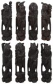 An early 20th century set of eight Chinese carved hardwood Dhaoist Immortals