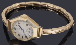 A ladies 9ct gold Tudor mechanical bracelet watch