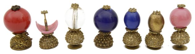 A collection of seven 19th century Qing dynasty Mandarin gilt metal and Peking glass hat buttons