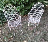 Two late 19th/early 20th century white painted wirework garden/ conservatory armchairs
