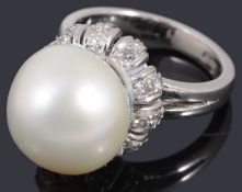 A white gold single stone cultured pearl and diamond ring
