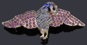 A silver gilt enamel sapphire and ruby phoenix brooch