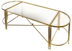 A lacquered brass and smokey glass set of three low occasional tables