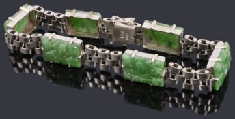 A white metal and jade panel bracelet