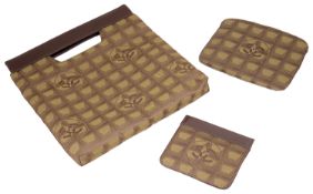 A Chanel new travel line tote shopping bag, makeup bag and coin purse