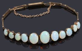 A delicate Edwardian graduated opal centrepiece bracelet