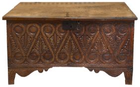 A 17th century carved oak six plank coffer