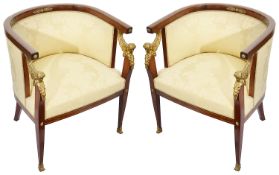 A pair of late French Empire style mahogany framed tub armchairs with ormolu mounts c.1900