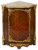 A French Louis XV walnut and ormolu mounted encoignure