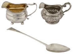 Late George III cream jug, a William IV cream jug and a George III Old English pattern basting spoon