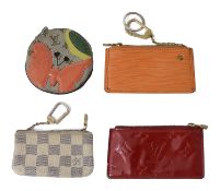 Four assorted Louis Vuitton coin purses