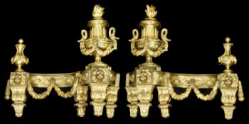 A pair of late 19th century French Louis XVI style ormolu chenets c.1900