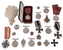 A selection of WWI and WWII medals and other related items