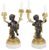 A pair of 19th century French bronze and ormolu two branch figural candelabra