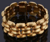 A four row hollow raised lozenge shaped panel bracelet