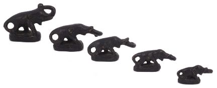 A graduated set of five oriental bronze elephant opium weights