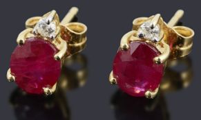 A pair of ruby and diamond stud earring,