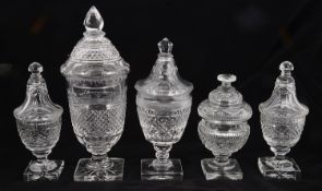 A collection of five 19th century and later Regency style sweetmeat jars and covers