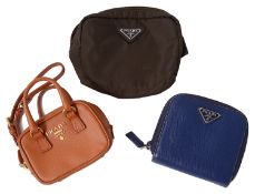 Three Prada coin purses
