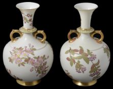 A matched pair of Royal Worcester blush Ivory twin handled vases, circa late 19th Century