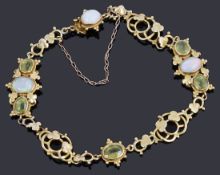 A delicate Victorian gold opal and peridot bracelet,